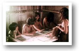 Missionary Kid Teaching Reading to Indian Children. Photo copyright by AAJ.