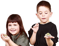 Children holding frogs. Photo copyrighted. Lic: h