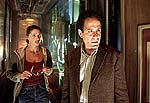 Shannon Elizabeth and Tony Shalhoub in “13 Ghosts”