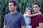 Mel Gibson, Abigail Breslin and Joaquin Phoenix. Scene from Signs. Copyright, Buena Vista Pictures